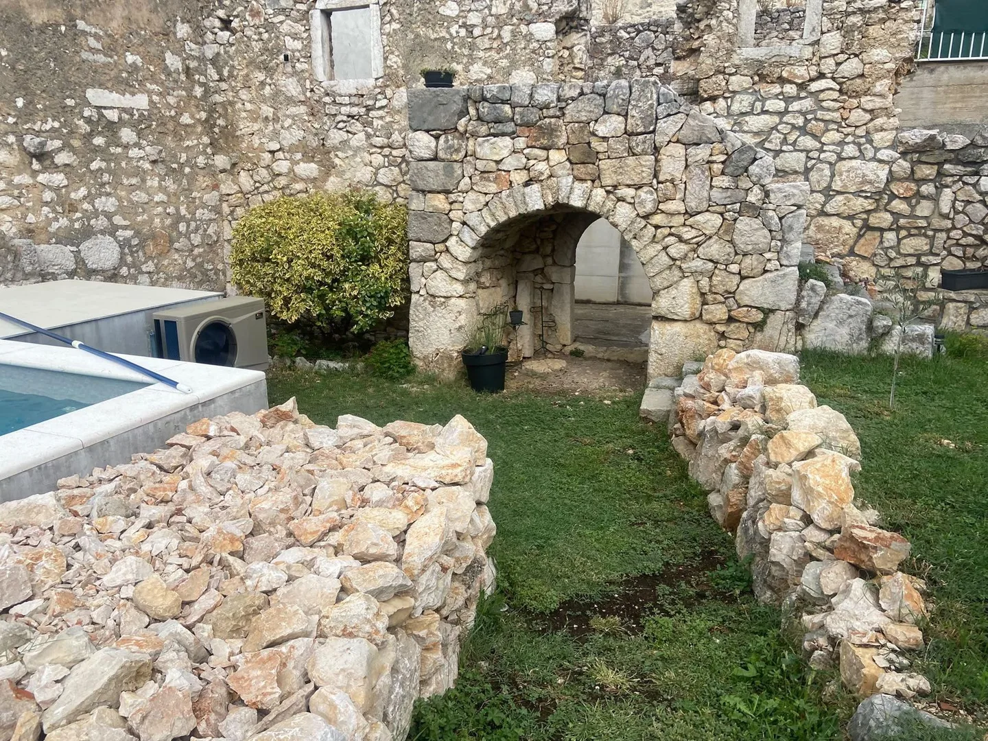 The ruin’s arch, the corner of the pool on the left